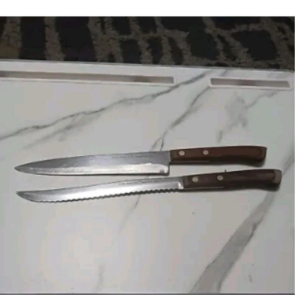 Pair of stainless steel Knives by Flint made in USA Surface scratches Partial